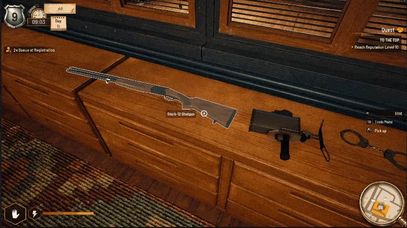 A shotgun, speed camera and handcuffs on a station desk in the tools demonstration
